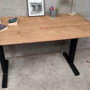 Unique wooden table with metal industrial legs.