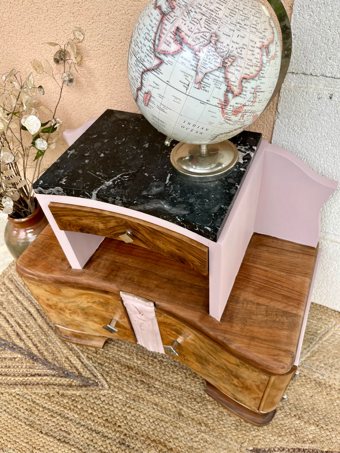 Art Deco bedside table in powder pink painted wood.