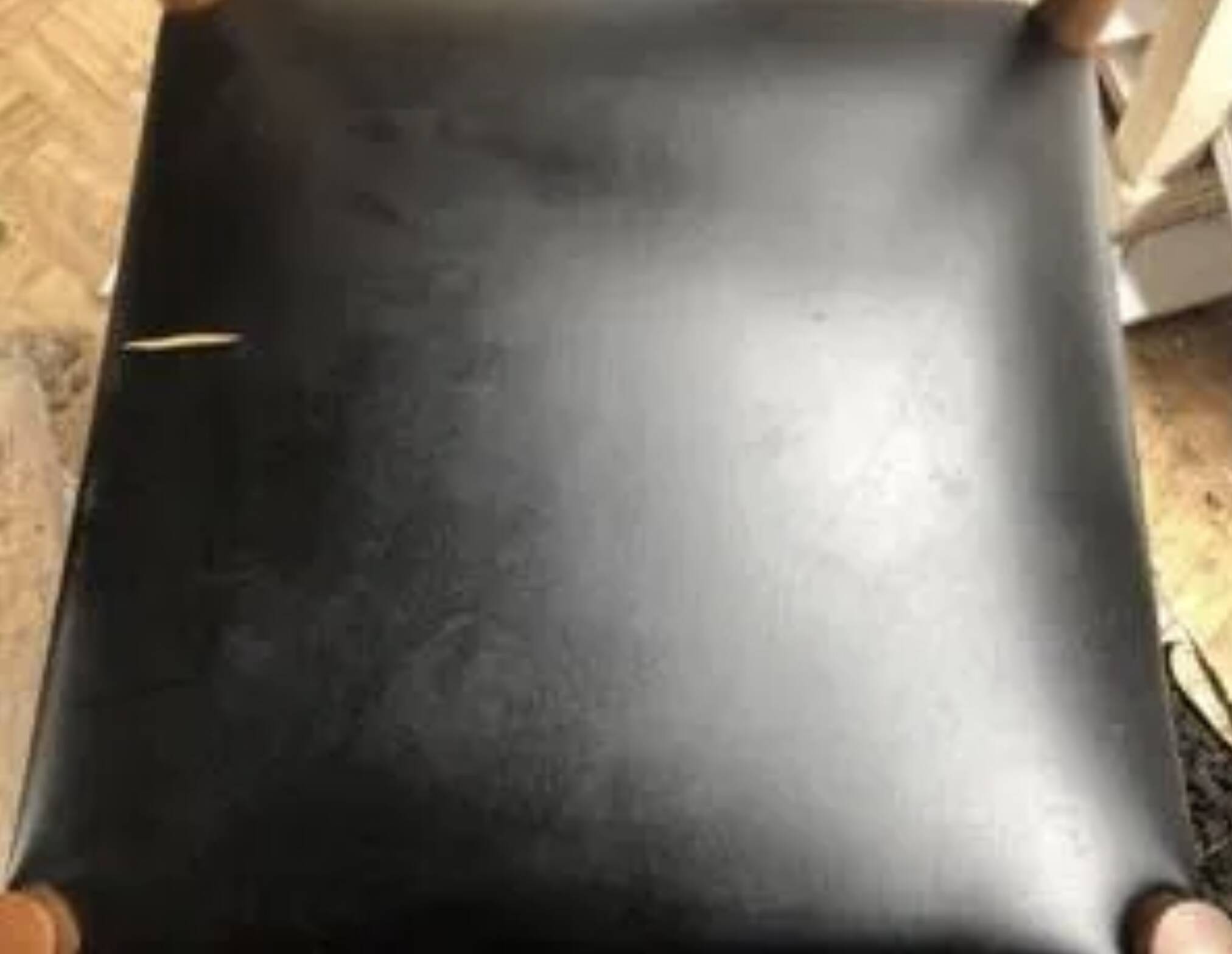 Set of 6 modernist chairs with black faux leather seats.