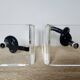 Bookends in plexiglass and knotted black tubes, 1980s design.