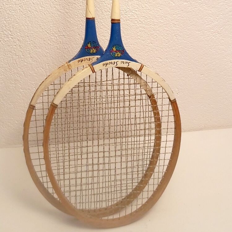 Pair of old wooden badminton rackets