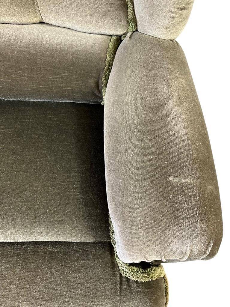 Vintage green two-seater sofa with fringes