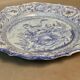 Plat creux rond en faïence bleue diamètre 48 cm signé