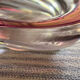 Empty pocket in pink tinted glass