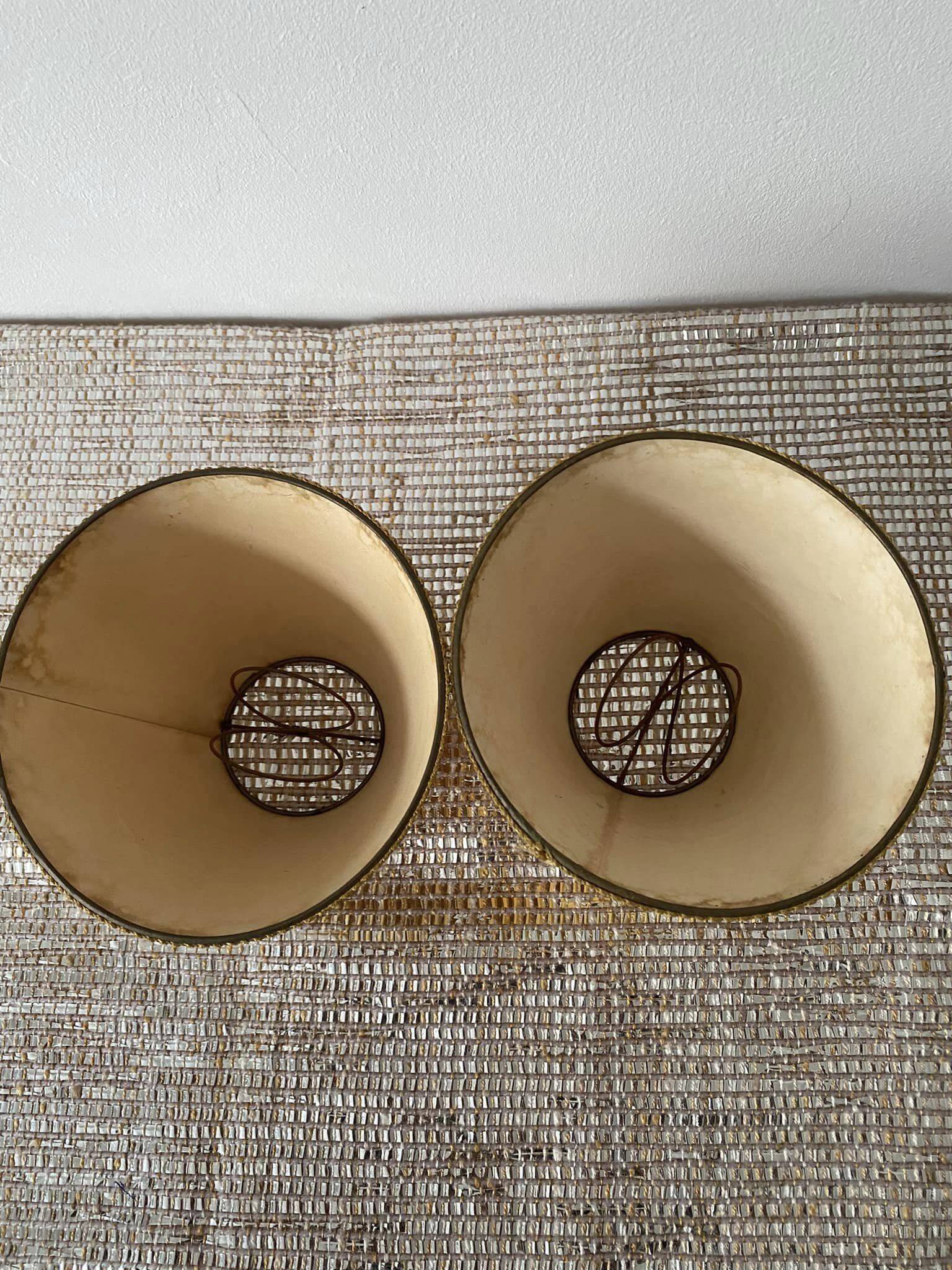 Pair of small old orange lampshades with trimmings