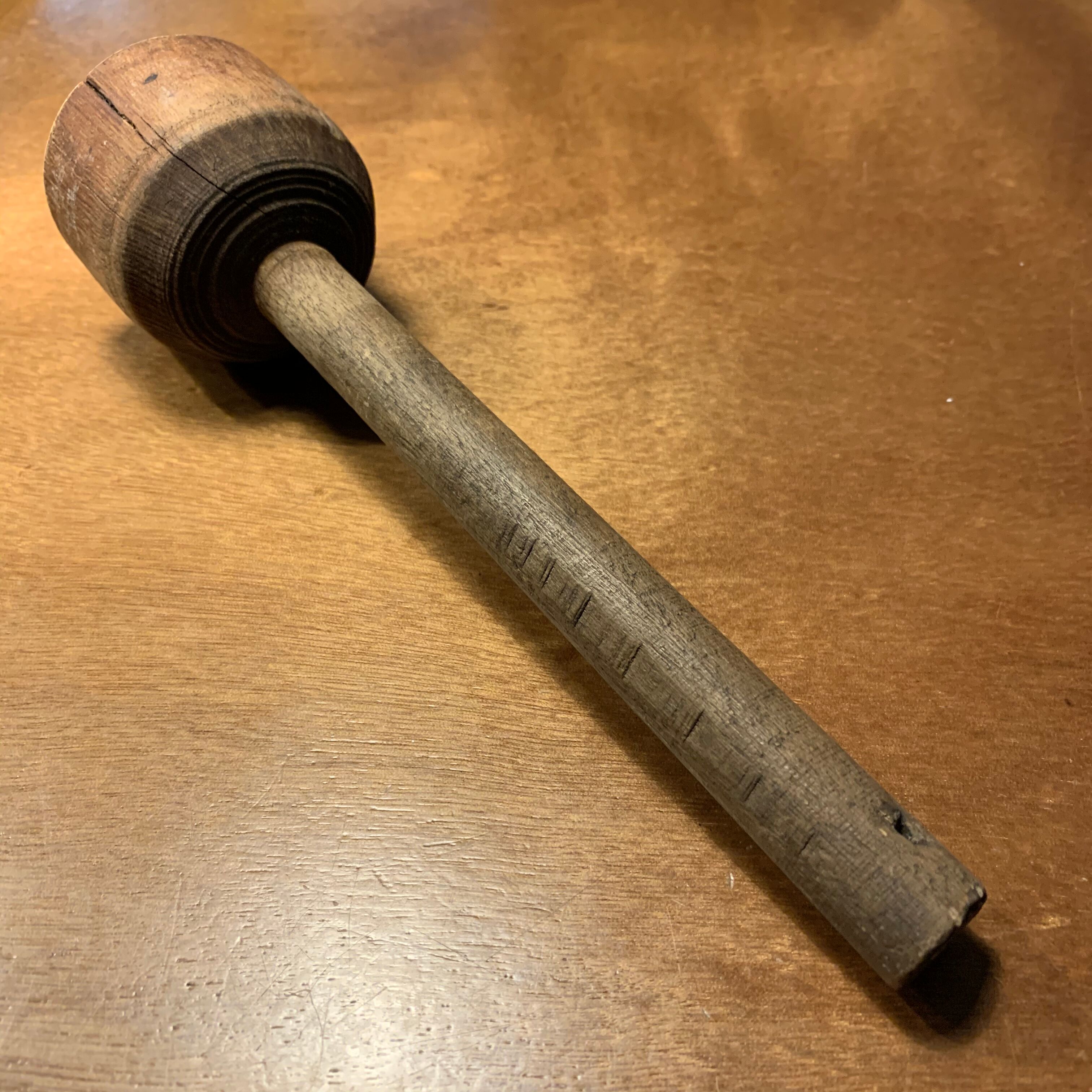 Old wooden pestle