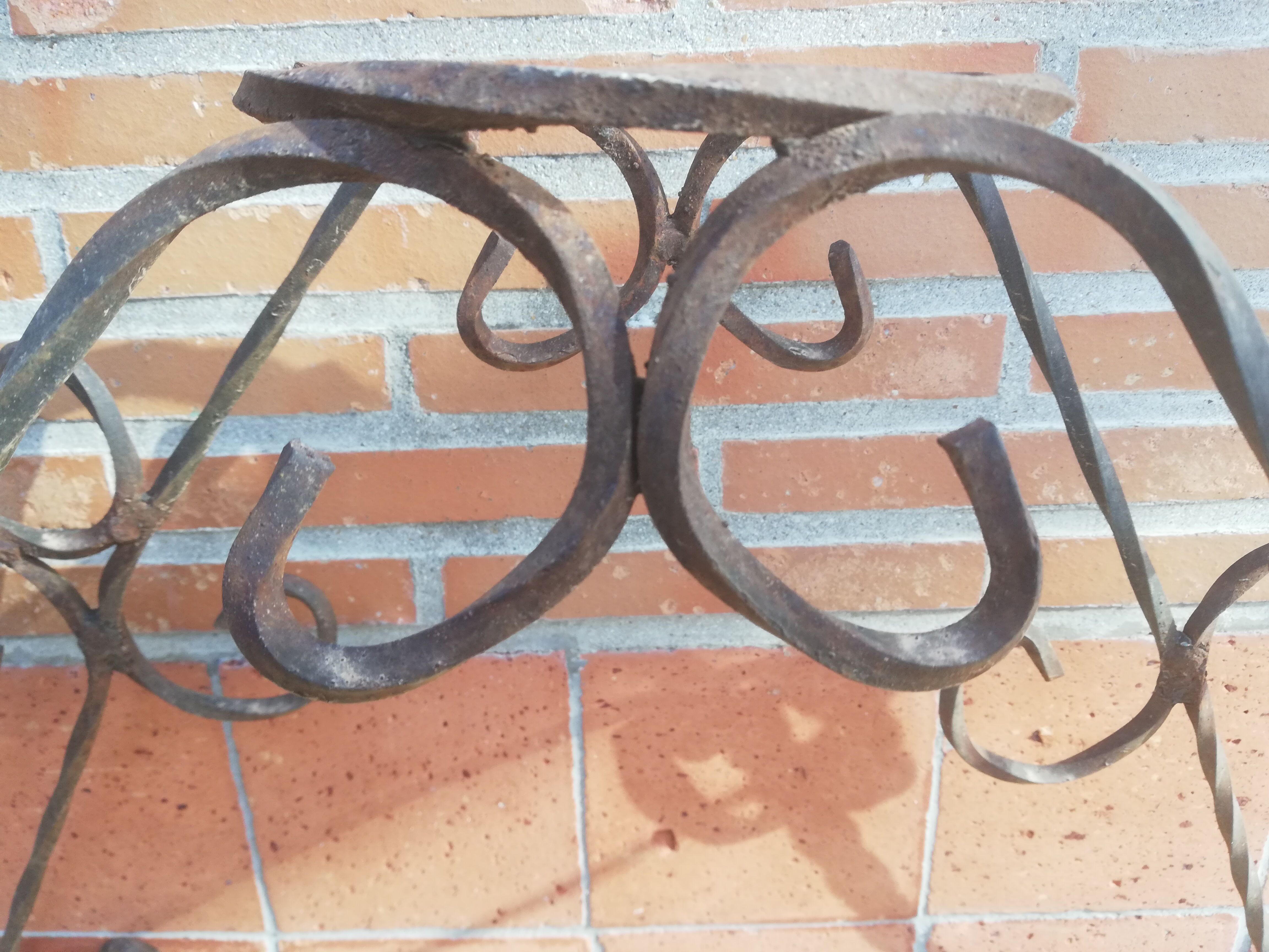 Wrought iron plant holders