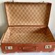 Small old brown suitcase