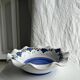 Small hand-painted earthenware salad bowl with garland of blue flowers, mark below