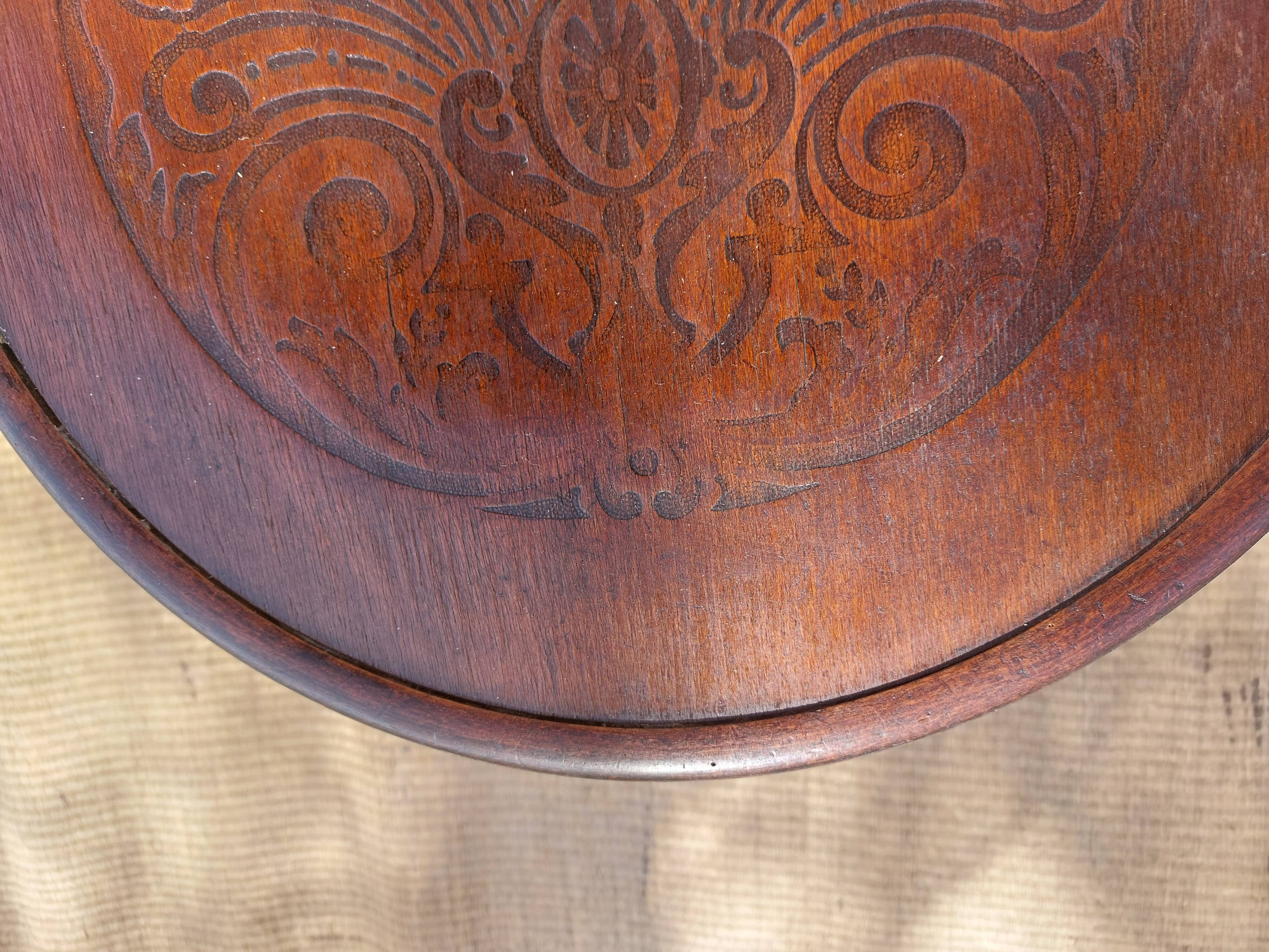 Swivel wooden armchair, pattern on seat