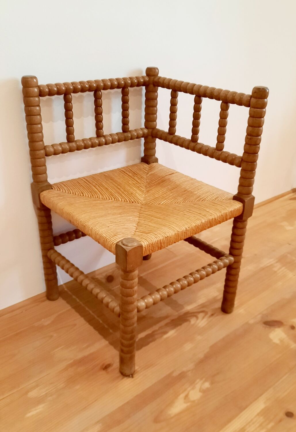 Turned wooden corner chair