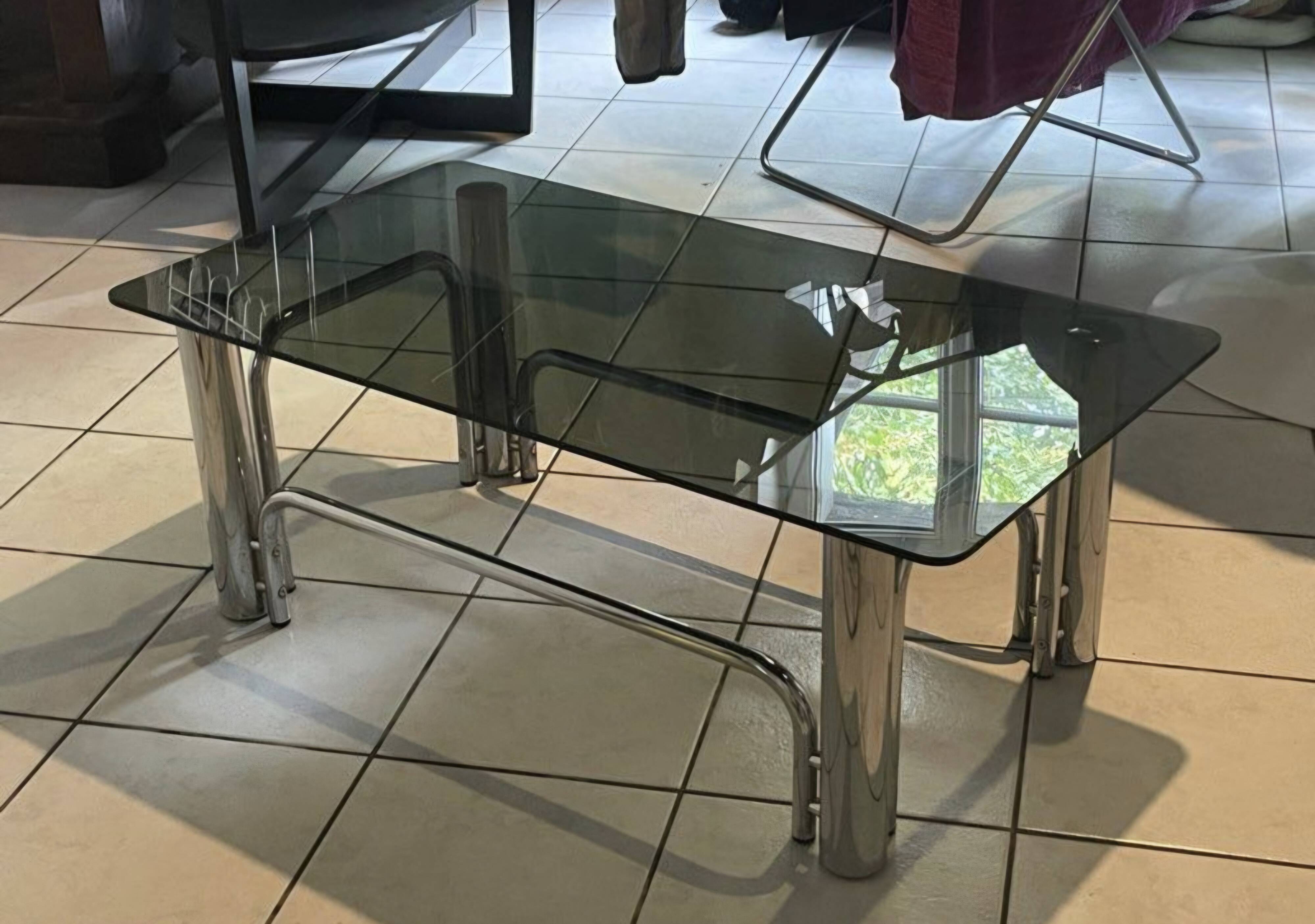 Vintage coffee table in smoked glass and chrome metal, 1970s design.