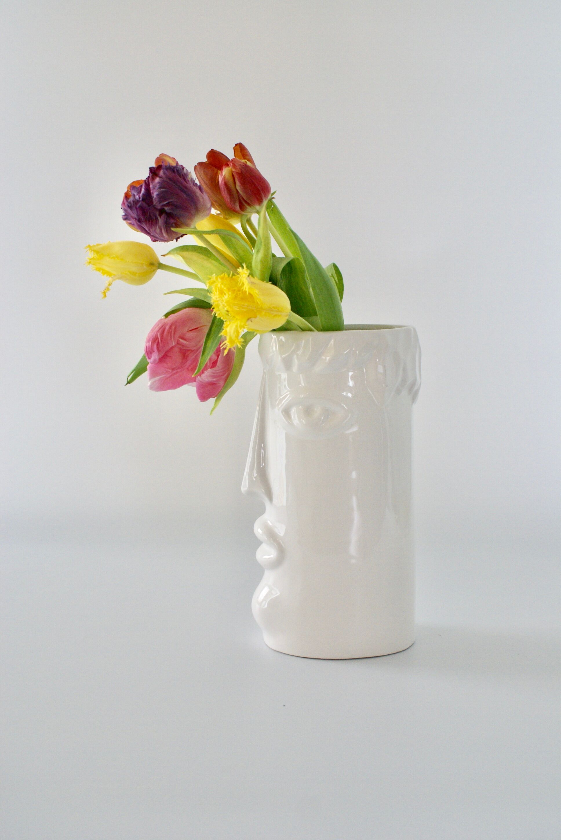 White glazed ceramic vase with face