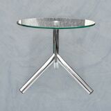 Modernist tripod side table in tempered glass and chrome metal.