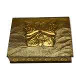 Old wooden box decorated with carved gold metal repelled vintage butterfly