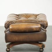 Elegant cowhide English chesterfield ottoman finished with decorative nails