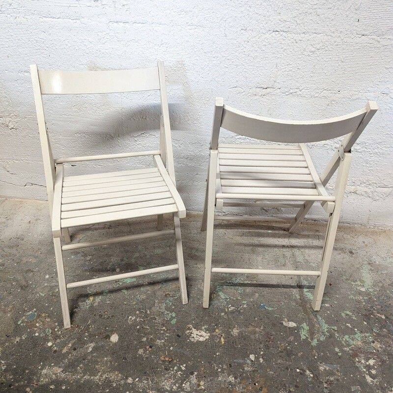Pair of white wooden folding chairs