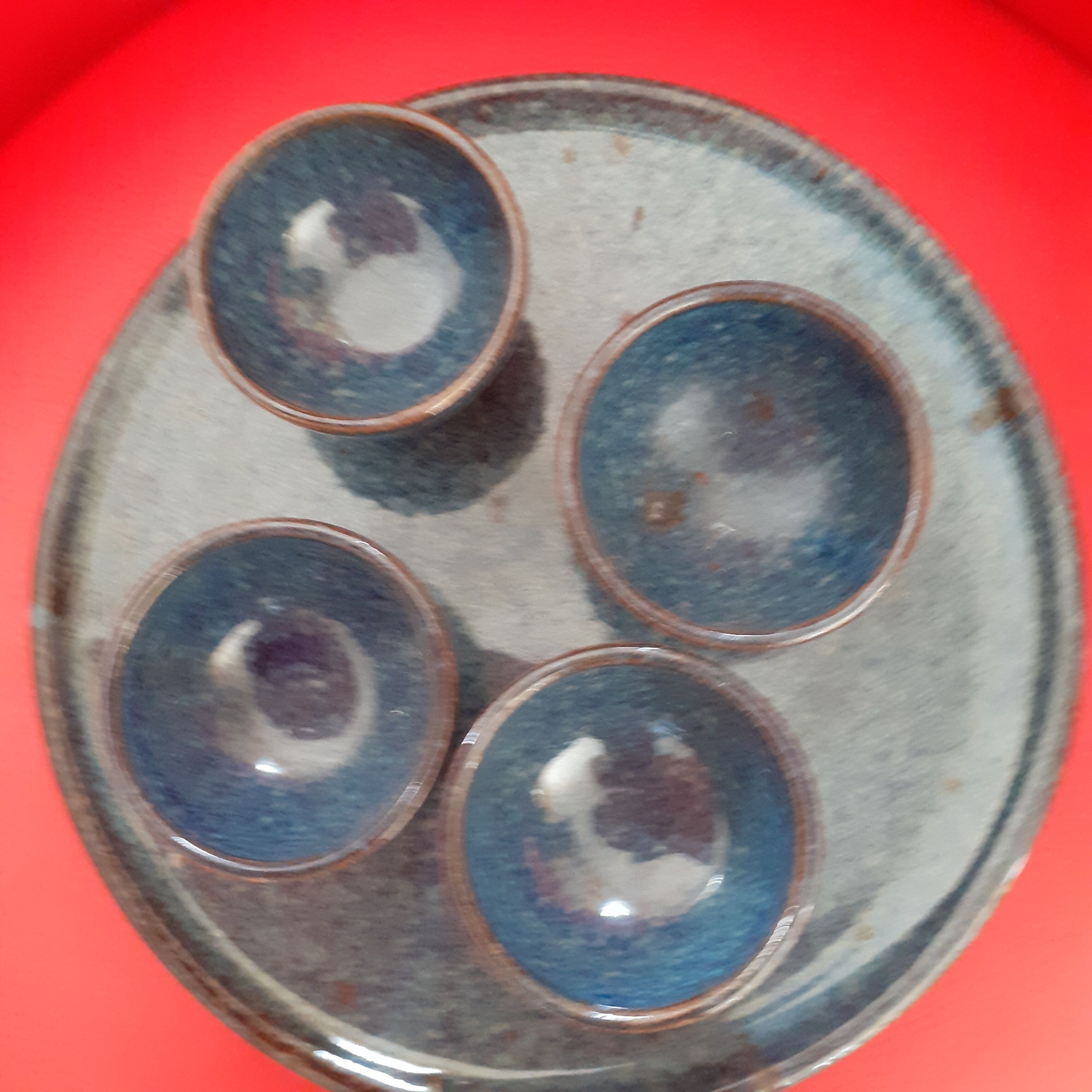 4 coquetiers on their midnight blue sandstone plate.