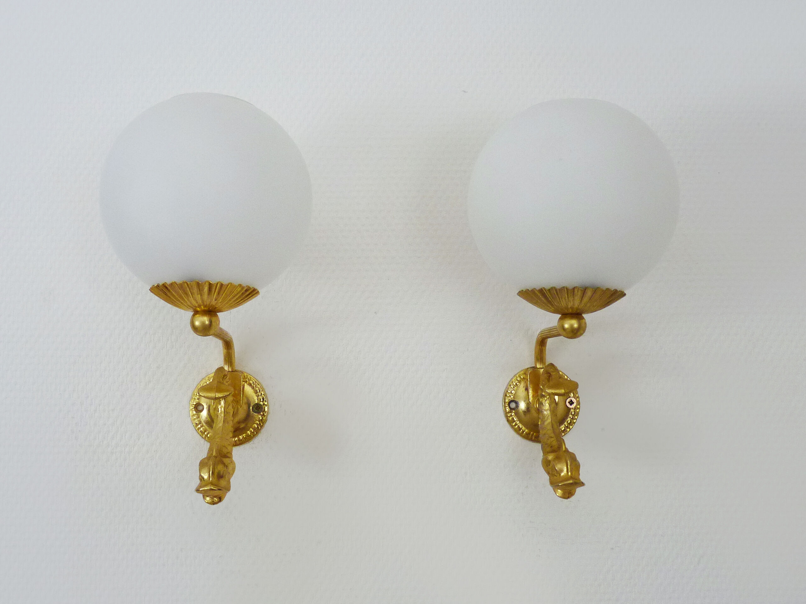 Old pair of wall sconces with carp, brass and globe in white opaline. Year 60