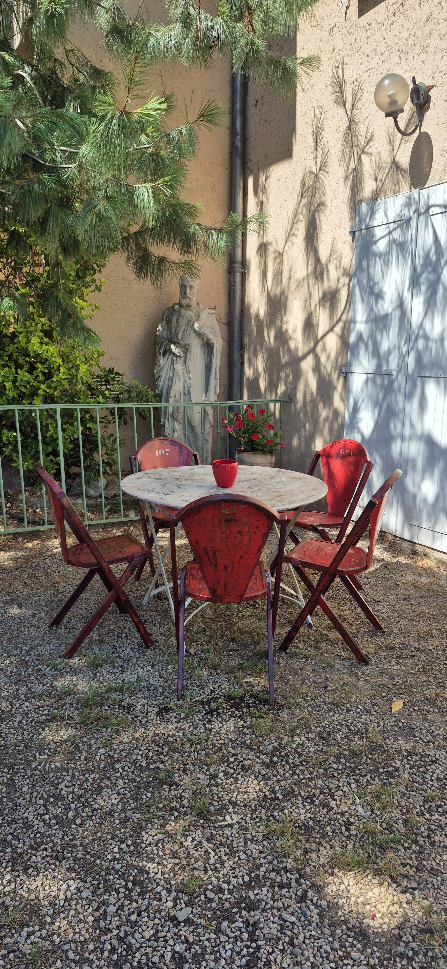 Set of 5 François Caruelle metal chairs