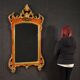 Miroir toscan laqué et doré du XXe siècle