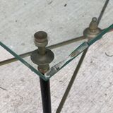 Regency style glass coffee table with crossed legs