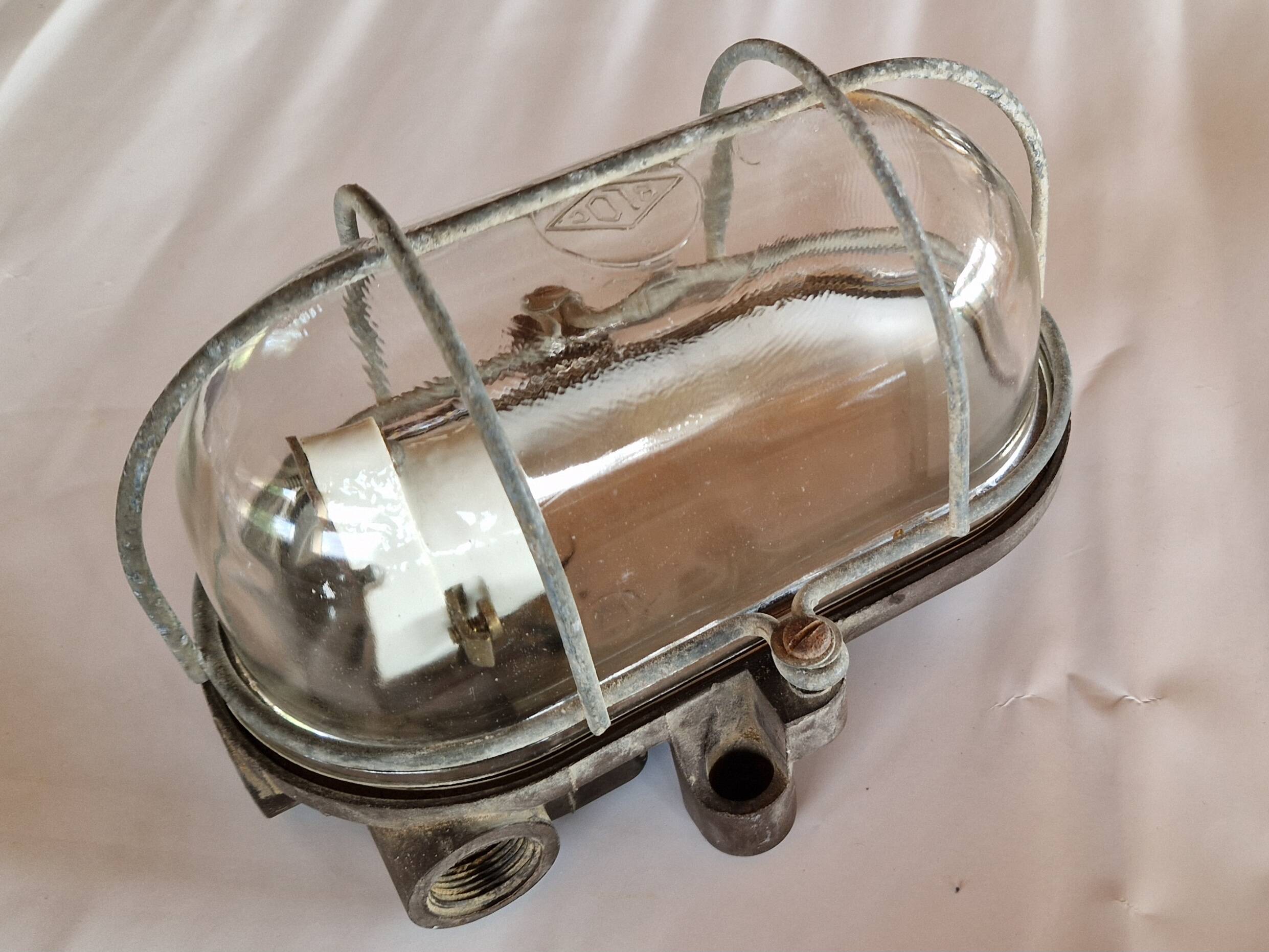 Pair of oval porthole wall lights in bakelite and glass