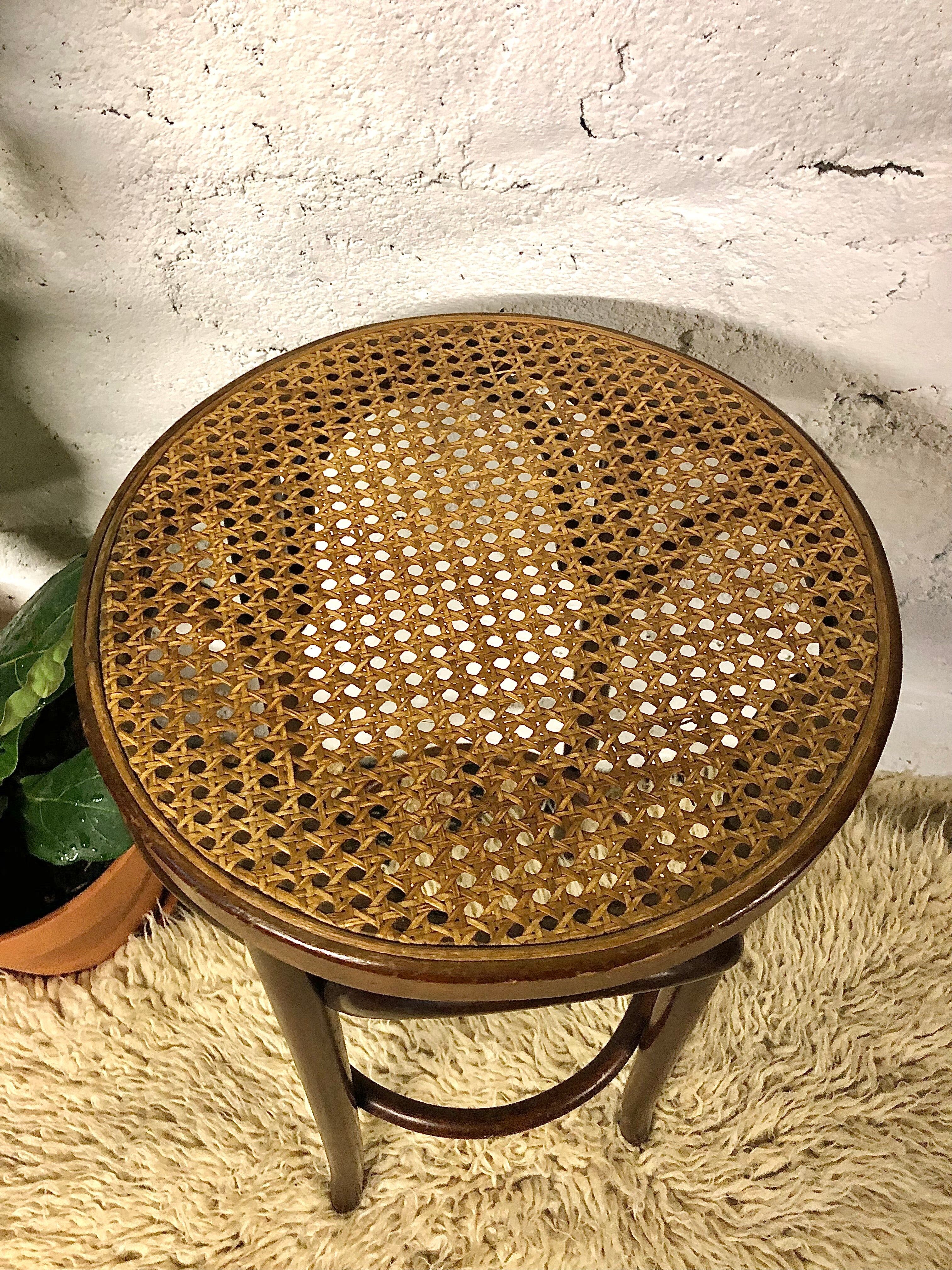 Curved wooden bar stool and cannage