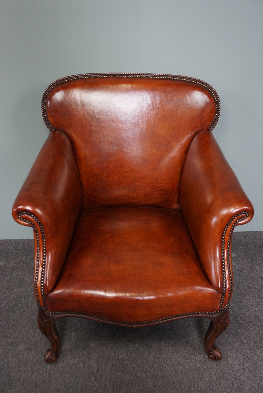 Old armchair in sheep leather