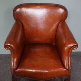 Old armchair in sheep leather