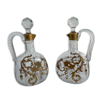 Pair of decanters, Cristallerie Baccarat, white crystal, painted in fine gold, Art Nouveau, 1900