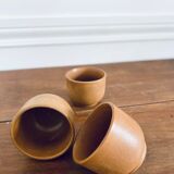 Three sandstone cups without handles