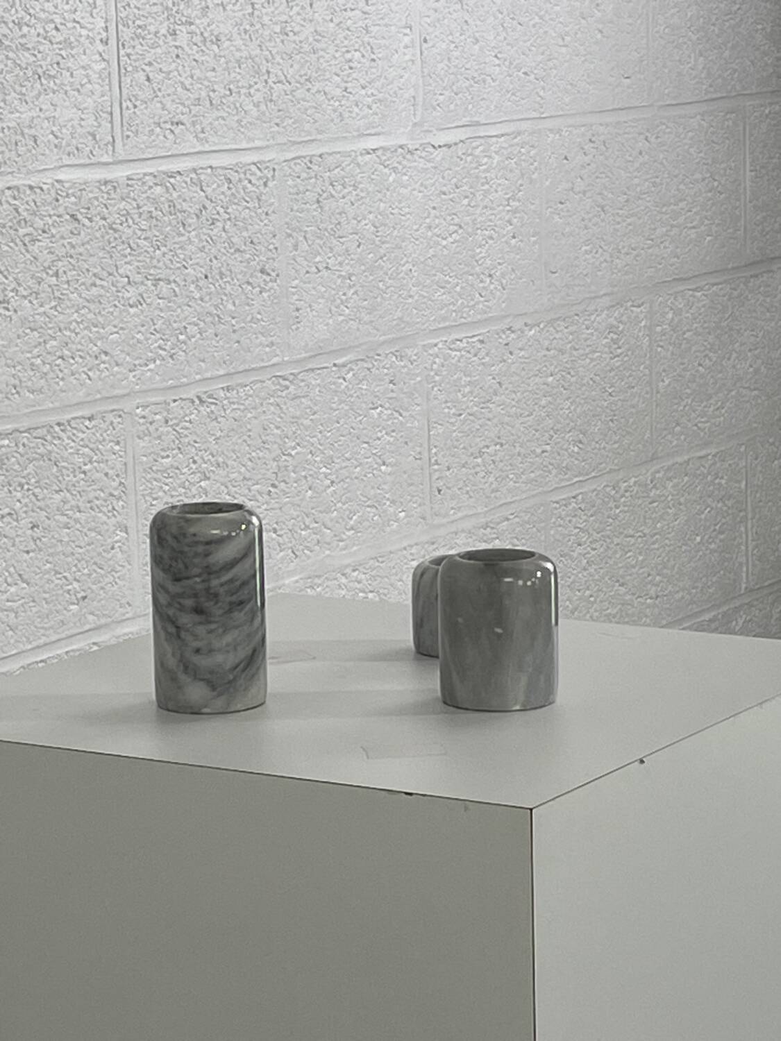 Pair of marble candlesticks
