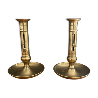 Pair of golden brass candle holders with pusher