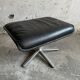 Wilkhahn Delta lounge chair in black leather with polished aluminum base and footrest (1970s)