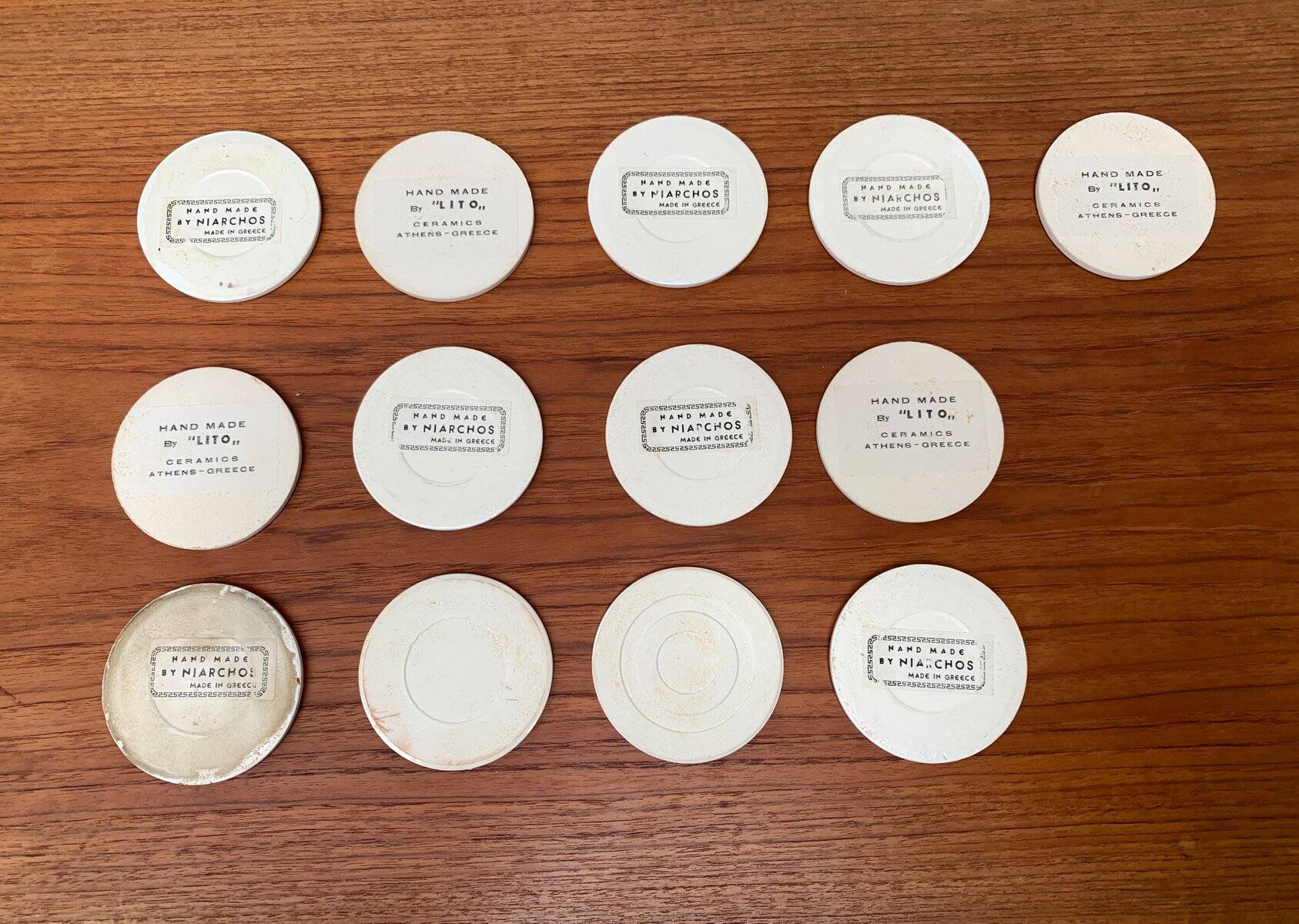 Set of 13 vintage ceramic coasters handmade by Lito Niarchos.