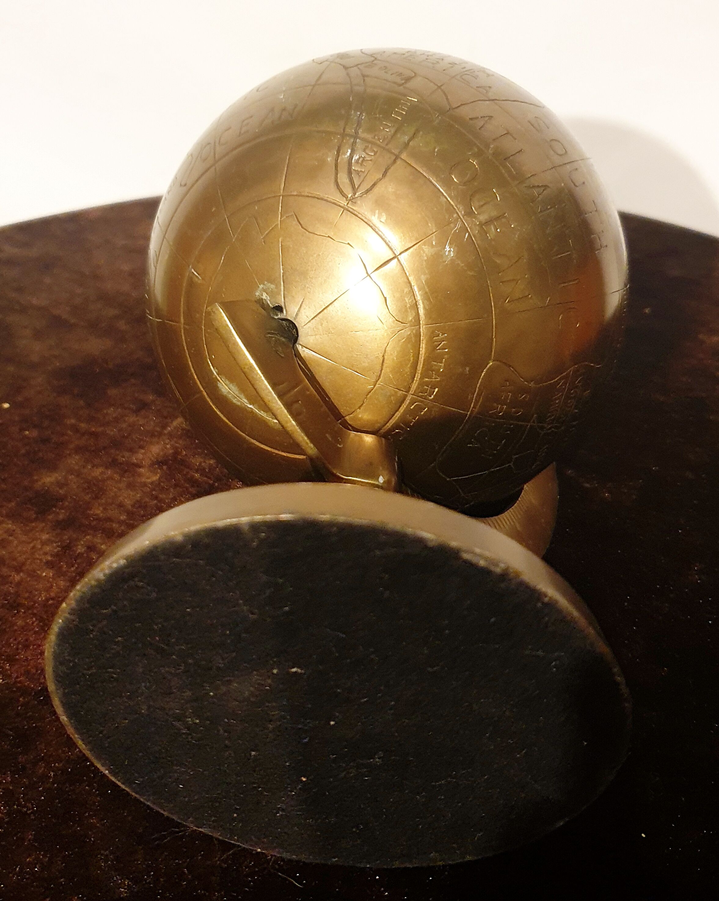Old terrestrial globe in copper, brass