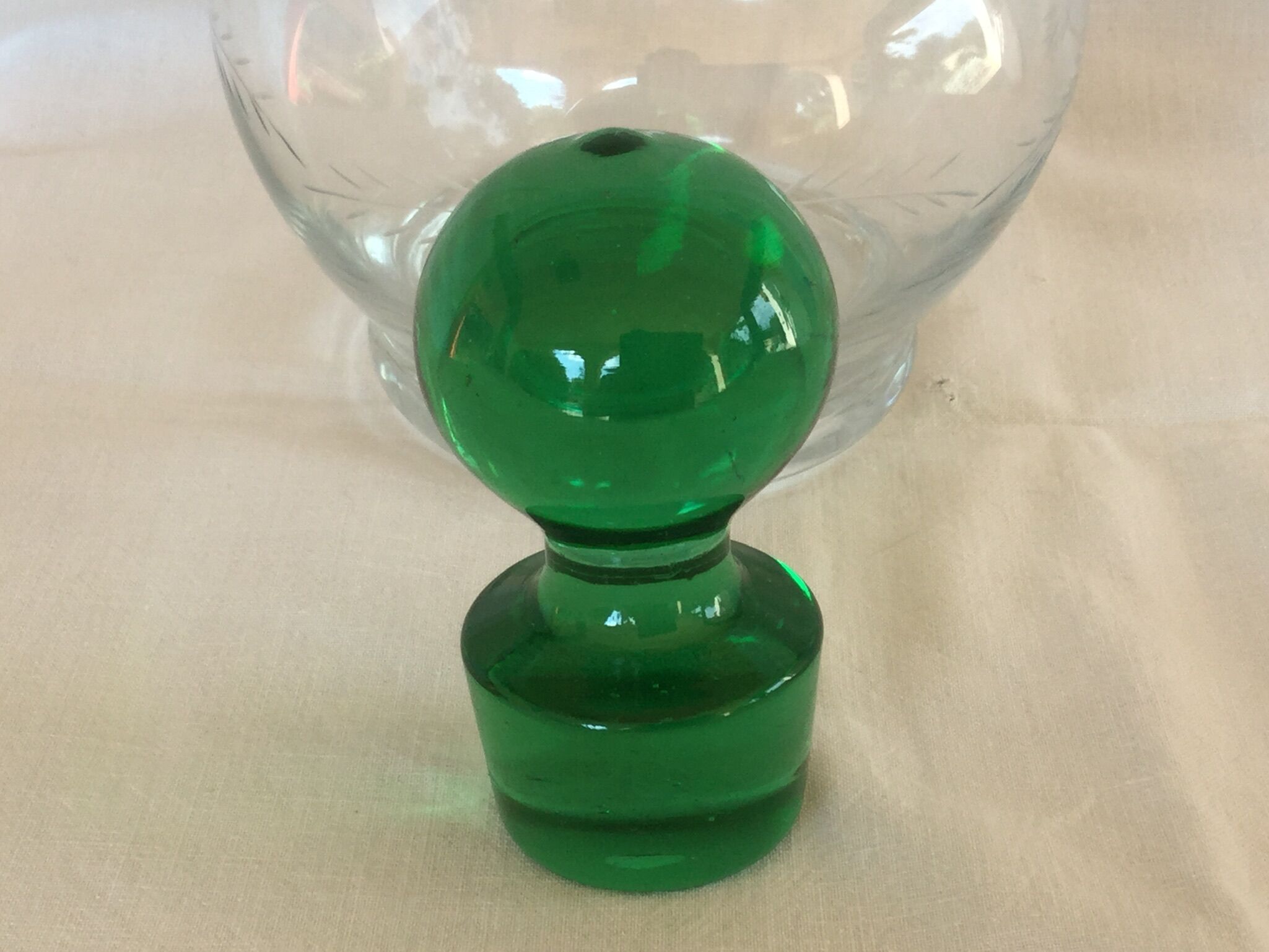 Glass wine carafe with green glass cap