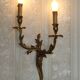 Bronze wall sconces decorated with acanthus leaves.