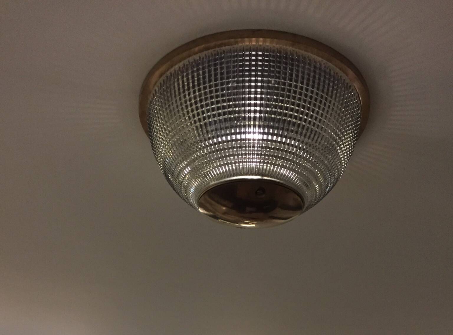 Gold holophane wall light