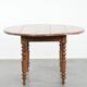 Antique English drop-leaf dining table made of walnut with elegant legs