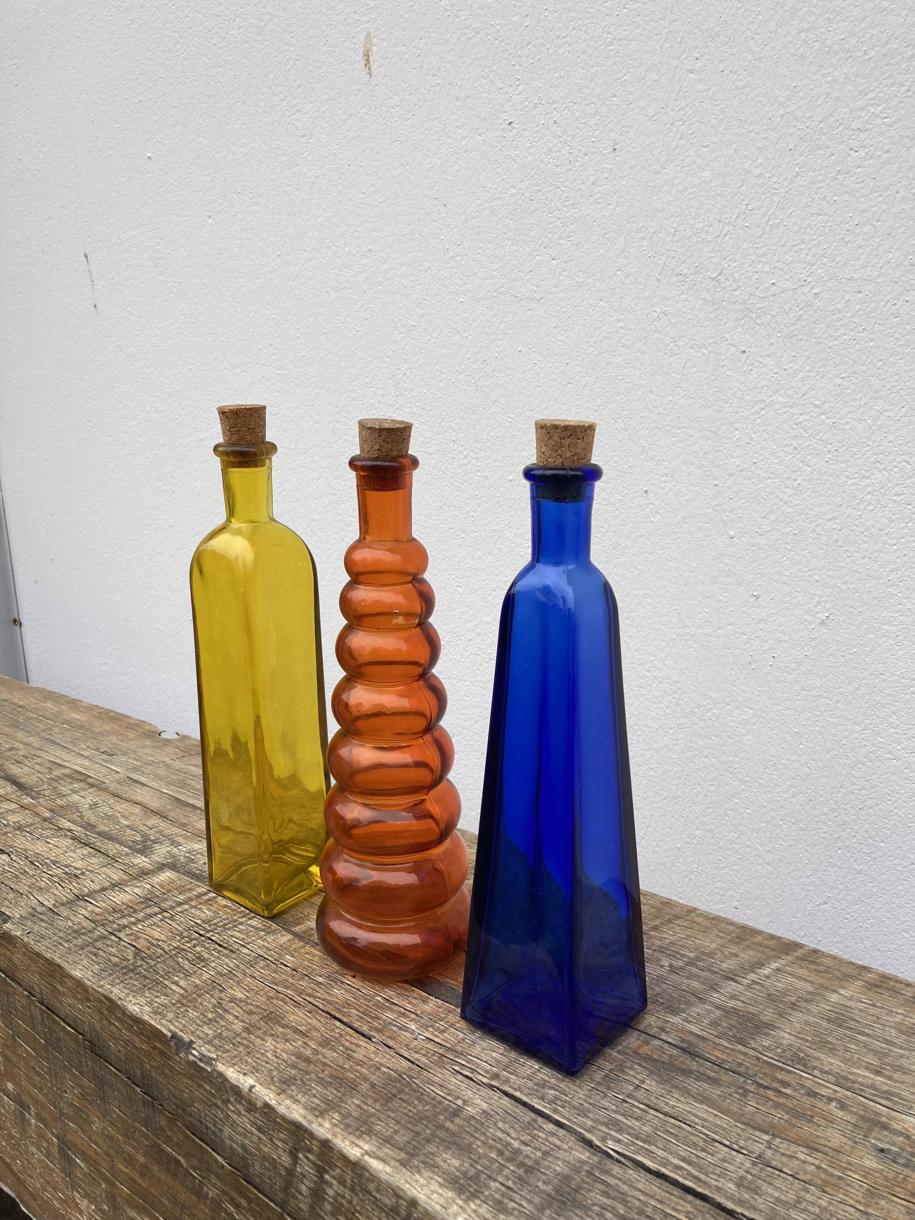 Trio of bottles 1970 color orange yellow and blue geometric shape