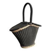 Vintage basket bag in rattan and black plastic from the 1950s.