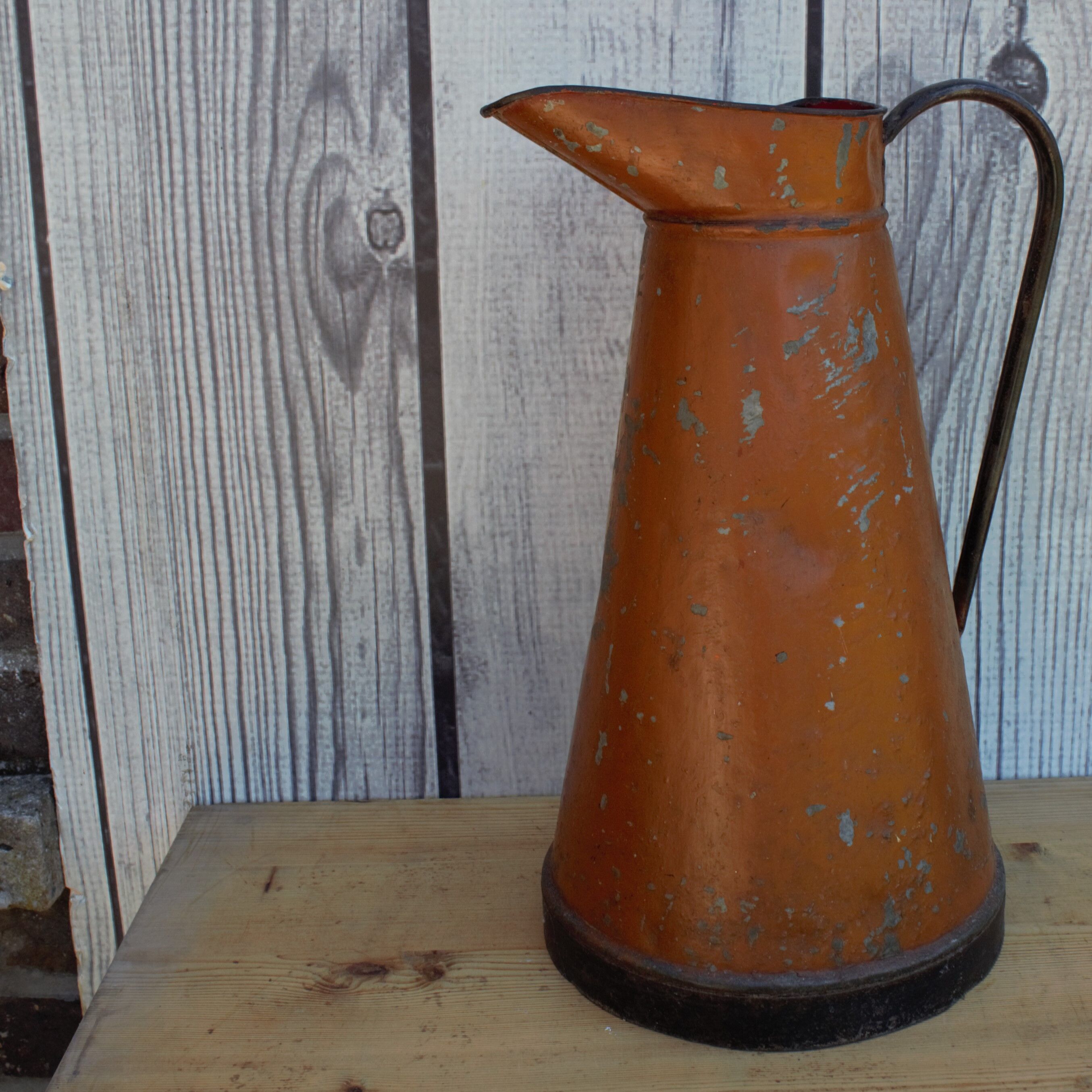 Old brown metal pitcher from France