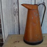 Old brown metal pitcher from France