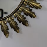 Miroir oval à feuilles d'acanthe en métal dorées