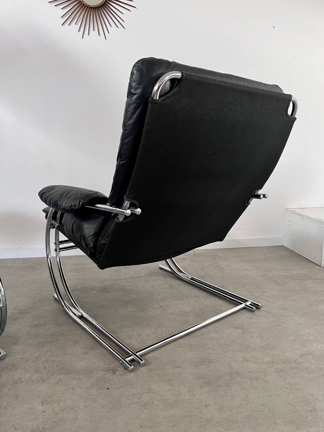 Old armchair and ottoman black leather tubular chrome bauhaus design from the 70s