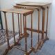 Sets of three nesting tables with painted landscape decorations in poplar.