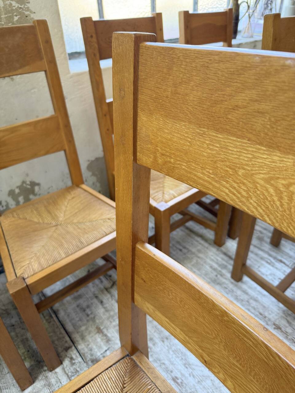 Set of 8 blond oak chairs with straw seats