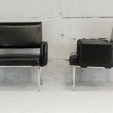 Pair of stainless steel, black leather-like armchairs, France, circa 1970